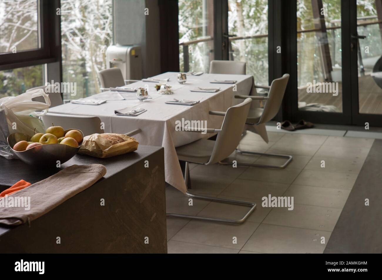 A dining room with served table, focus in the foreground Stock Photo