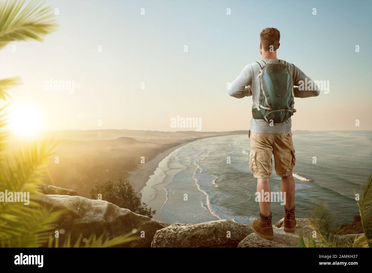Hiker with a scenic view over a coastline Stock Photo