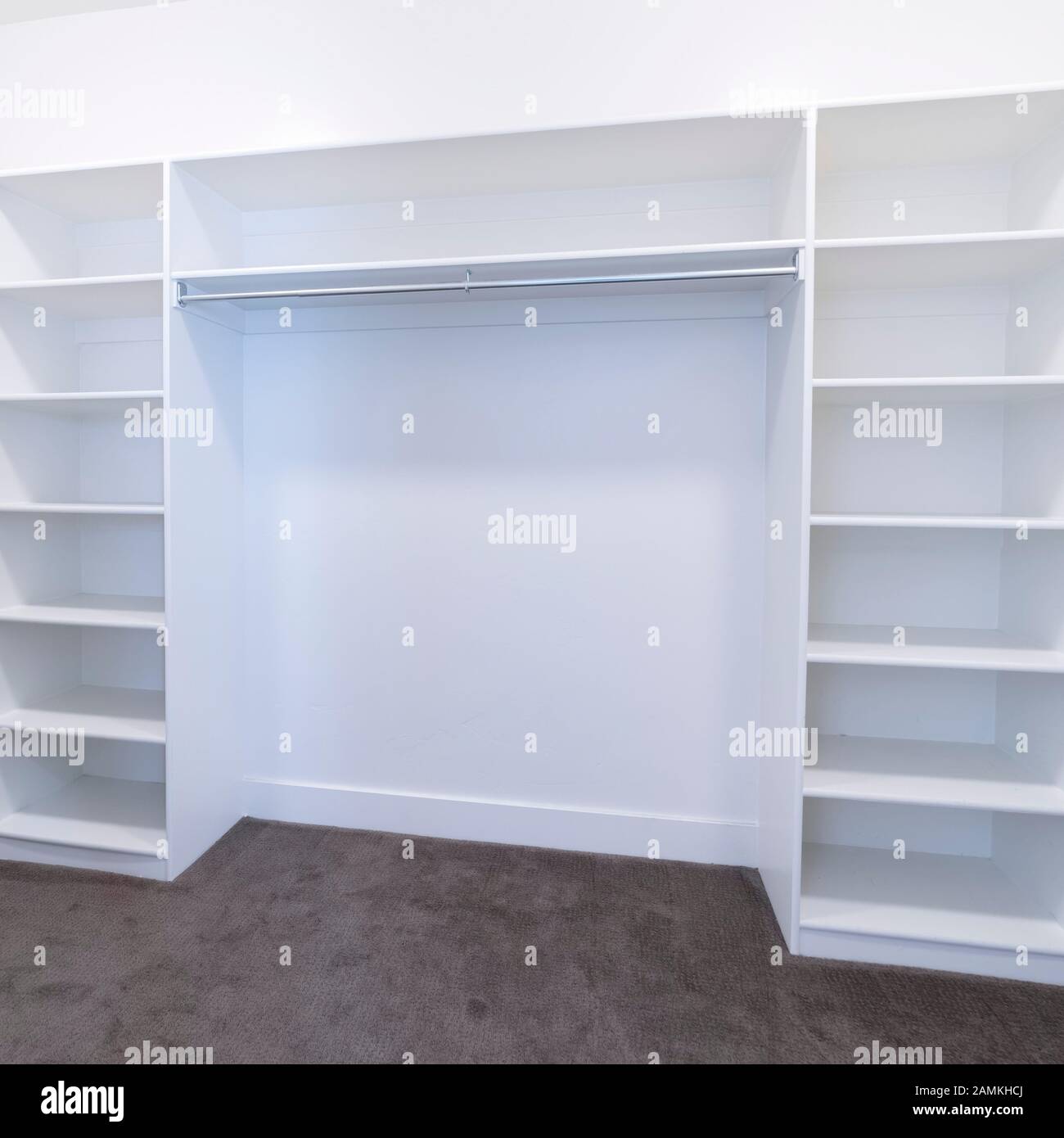 Square Empty fitted interior of a walk-in closet Stock Photo - Alamy