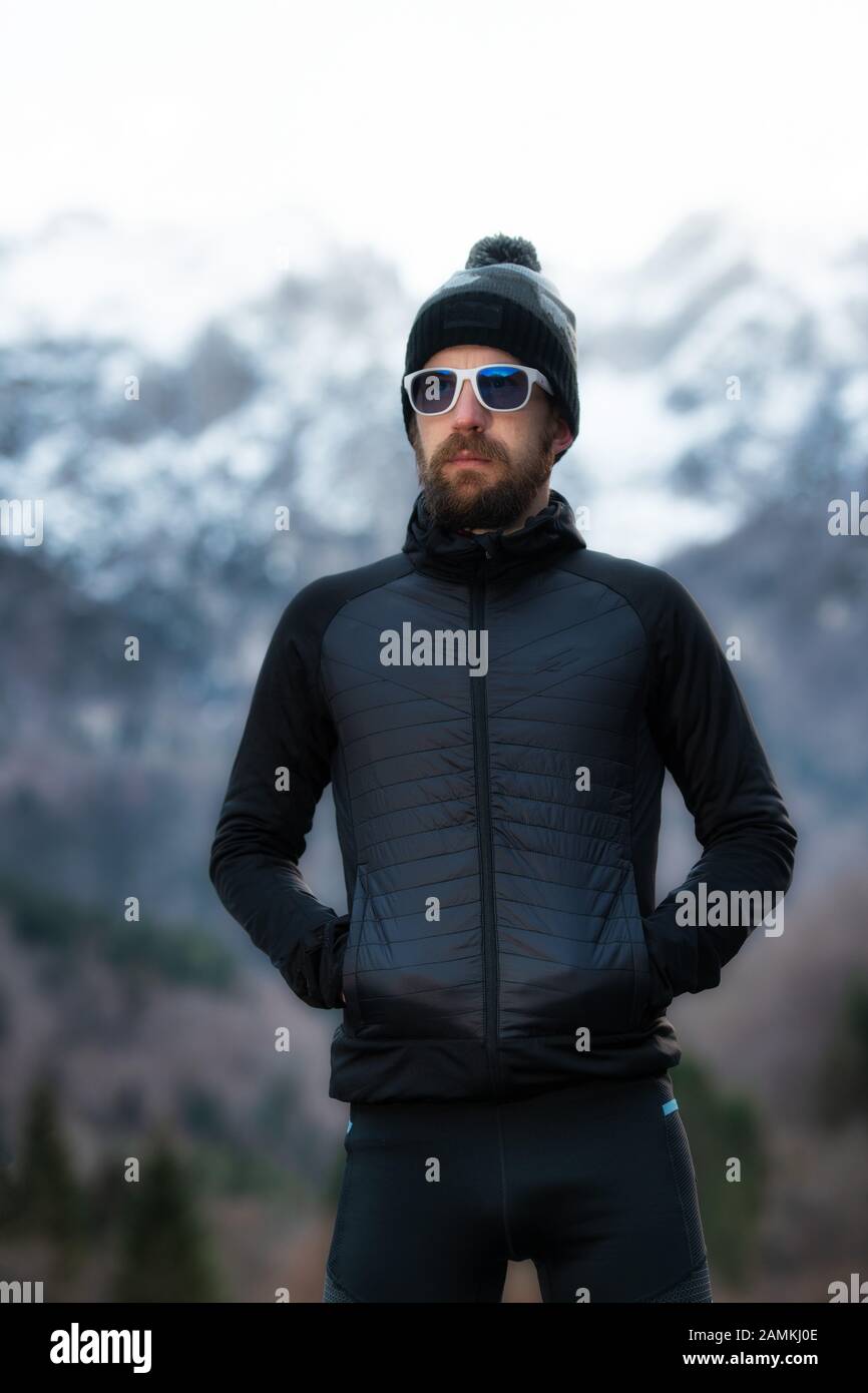 Man with beard mountaineer portrait only the mountains Stock Photo