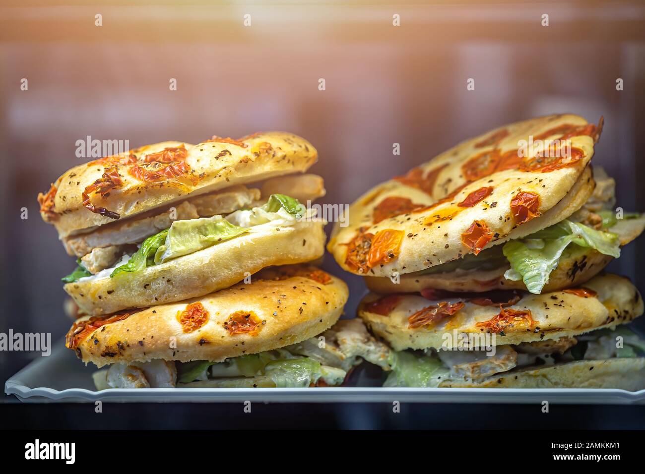 Chicken, salad and sundried tomatoes focaccia sandwiches for sale on