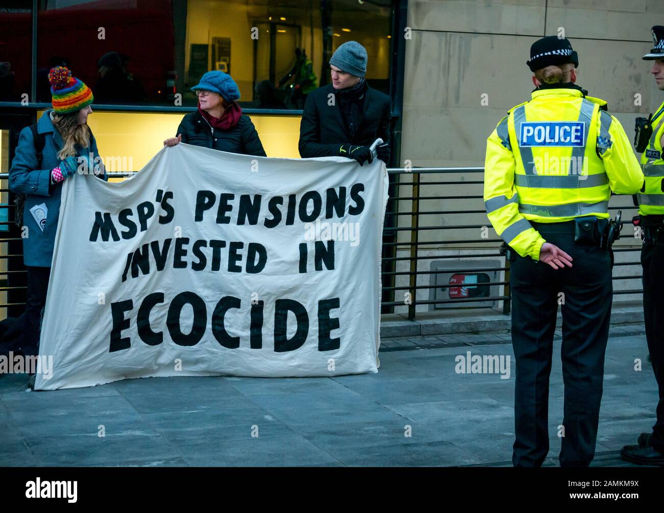 Leith Street, Edinburgh, Scotland, United Kingdom, 14 January 2020. Extinction Rebellion: part of the campaign’s week long action against companies in the fossil fuels industry. The activists target financial company Baillie Gifford from before dawn, who manage the MSP pension fund which includes shares in the oil company Shell. There is a large police presence to keep the situation in order Stock Photo