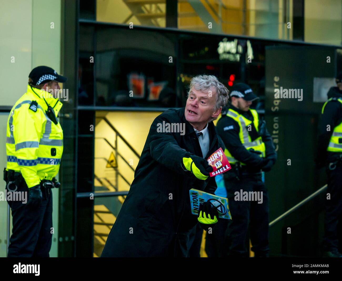 Leith Street, Edinburgh, Scotland, United Kingdom, 14 January 2020. Extinction Rebellion: part of the campaign’s week long action against companies in the fossil fuels industry. The activists target financial company Baillie Gifford from before dawn, who manage the MSP pension fund which includes shares in the oil company Shell. There is a large police presence to keep the situation in order Stock Photo