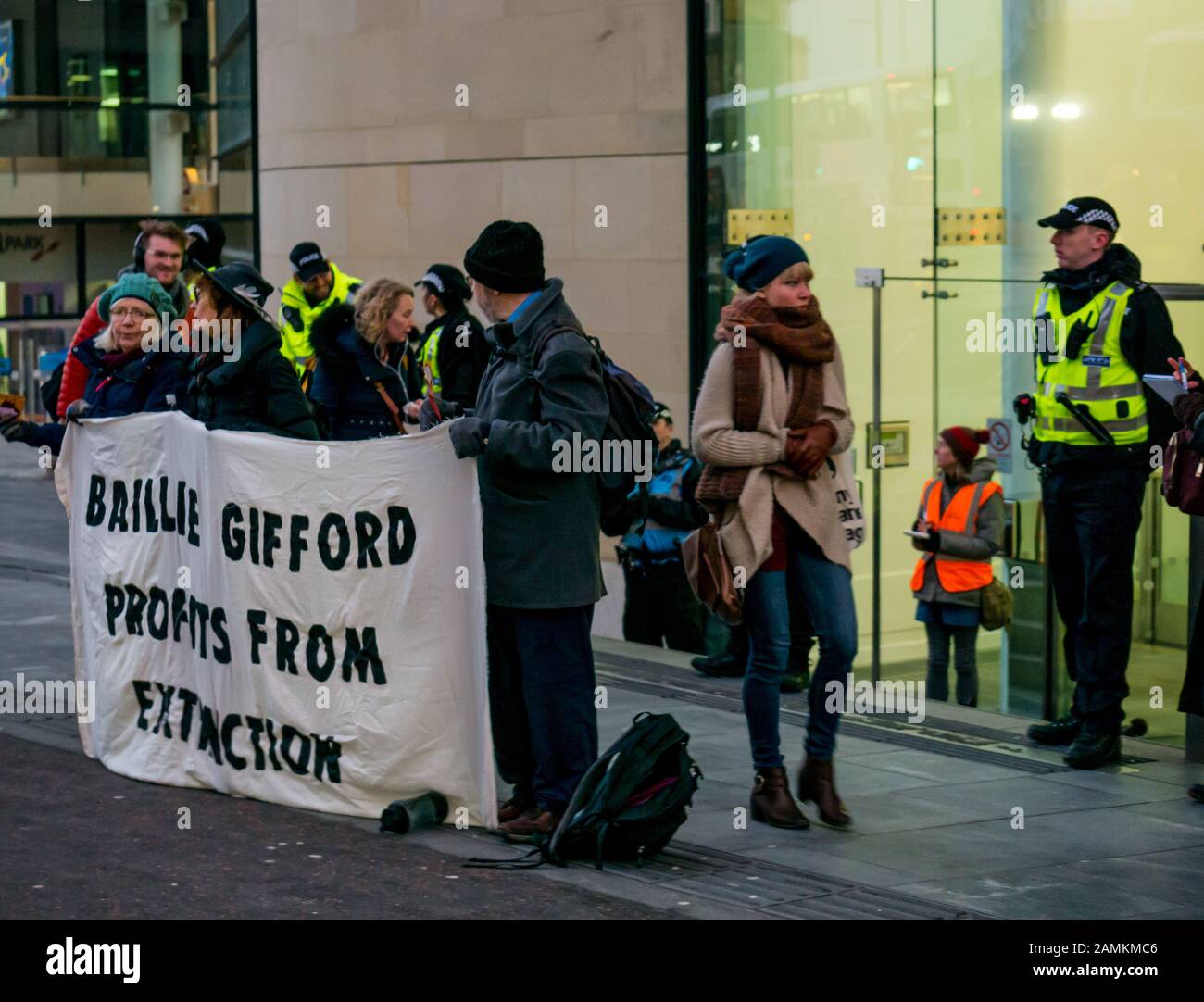 Leith Street, Edinburgh, Scotland, United Kingdom, 14 January 2020. Extinction Rebellion: part of the campaign’s week long action against companies in the fossil fuels industry. The activists target financial company Baillie Gifford from before dawn, who manage the MSP pension fund which includes shares in the oil company Shell. There is a large police presence to keep the situation in order Stock Photo
