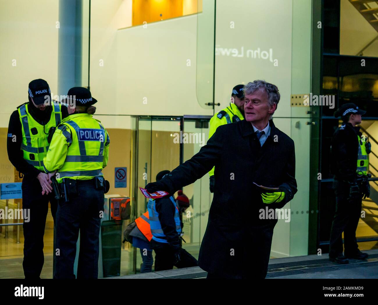 Leith Street, Edinburgh, Scotland, United Kingdom, 14 January 2020. Extinction Rebellion: part of the campaign’s week long action against companies in the fossil fuels industry. The activists target financial company Baillie Gifford from before dawn, who manage the MSP pension fund which includes shares in the oil company Shell. There is a large police presence to keep the situation in order Stock Photo