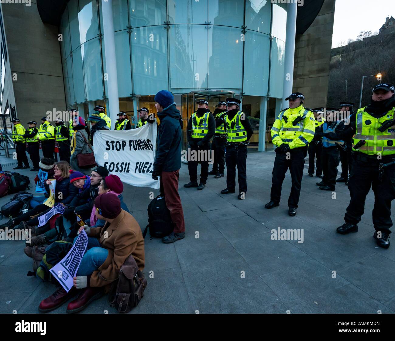 Leith Street, Edinburgh, Scotland, United Kingdom, 14 January 2020. Extinction Rebellion: part of the campaign’s week long action against companies in the fossil fuels industry. The activists target financial company Baillie Gifford from before dawn, who manage the MSP pension fund which includes shares in the oil company Shell. There is a large police presence to keep the situation in order Stock Photo