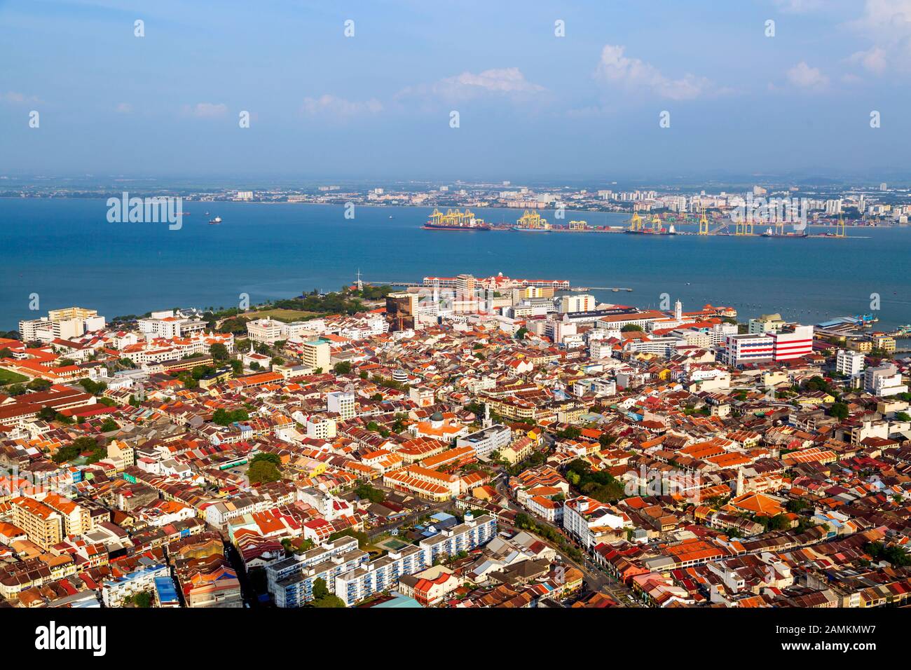 Aerial view of the city of Georgetown from the top of the Komtar Tower in Georgetown, Penang Island, Malaysia looking towards Butterworth and the Stra Stock Photo
