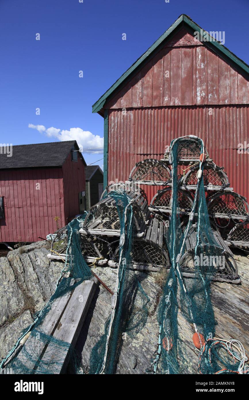 Fishing nets laid out to dry in front of a fisherman's house in the well-known town of Blue Rocks near Lunenburg, Mahone Bay, Nova Scotia, Atlantic Canada, North America. [automated translation] Stock Photo