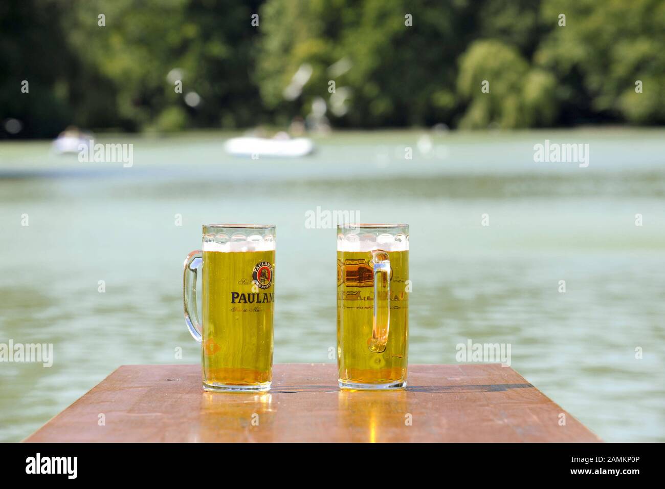 Two filled beer glasses on a table of the 'Seehaus' beer garden at Kleinhesseloher See in the English Garden. [automated translation] Stock Photo