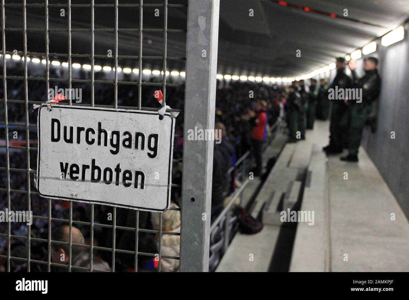 Football Champions League: FC Bayern Munich - FC Basel in the Allianz Arena, in the picture policemen in the guest fan block. In the foreground a fence with a sign 'no entry'. [automated translation] Stock Photo