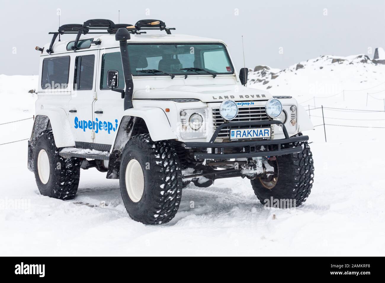 Superjeep Land Rover parked in snow in Iceland in January - Super jeep Stock Photo