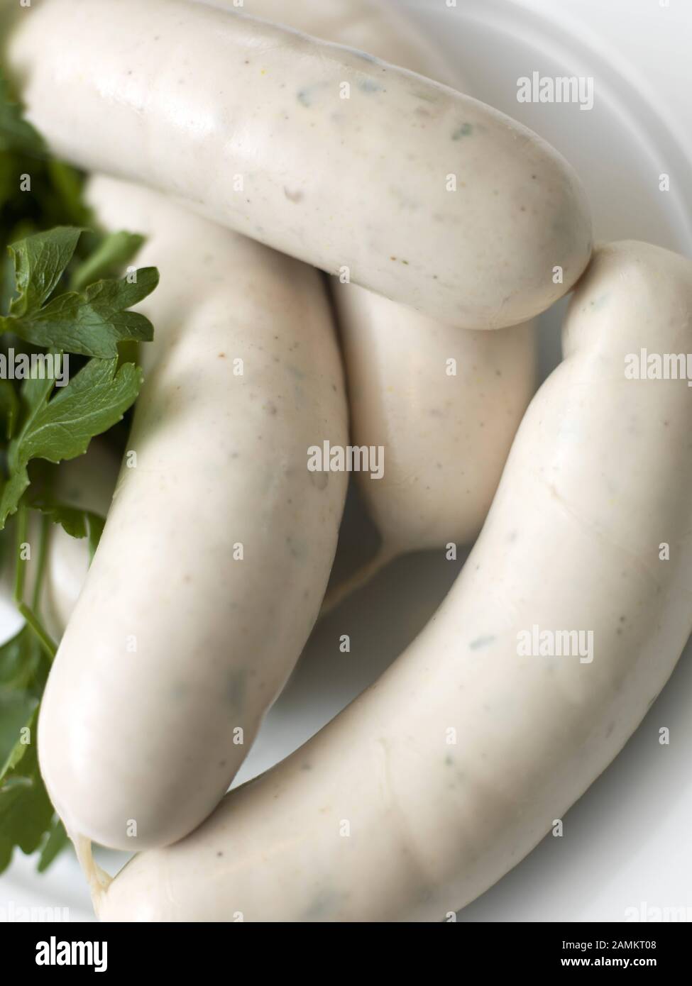 Bavarian snack: white sausage garnished with parsley. [automated translation] Stock Photo
