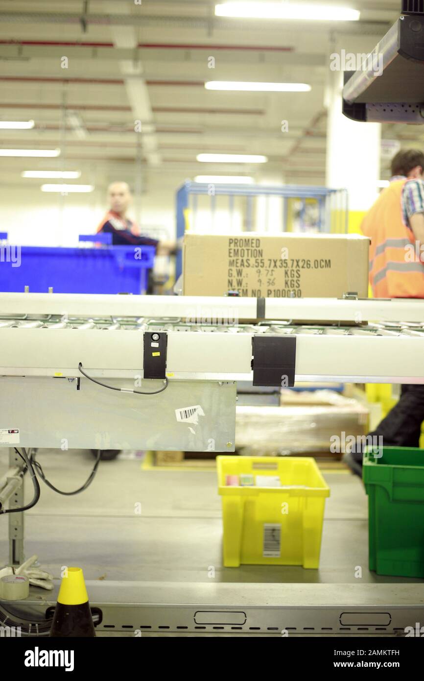 Parcel on a conveyor belt in the Amazon logistics centre. [automated translation] Stock Photo