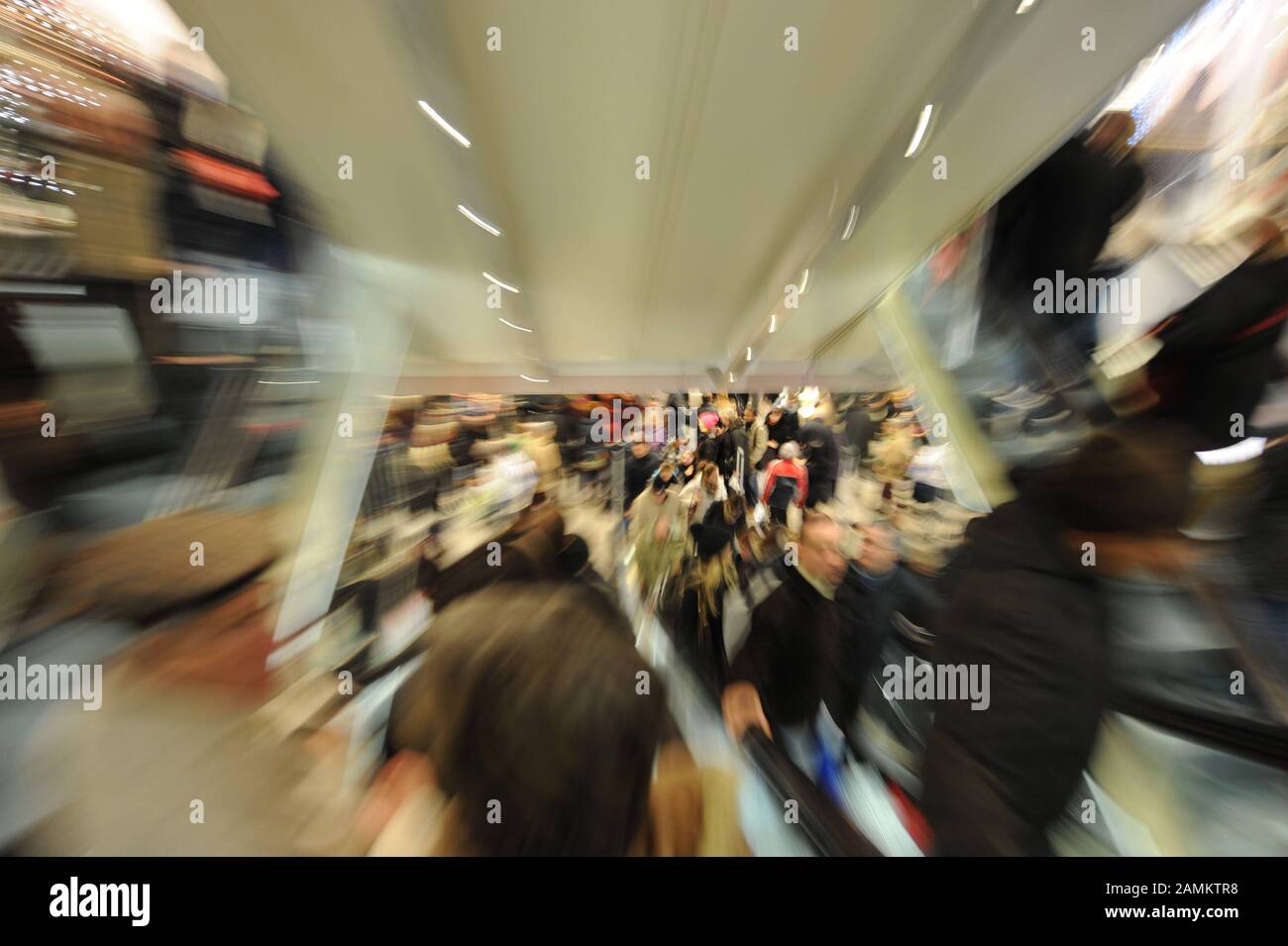 Christmas shoppers crowd the escalator in a department store in downtown Munich. [automated translation] Stock Photo