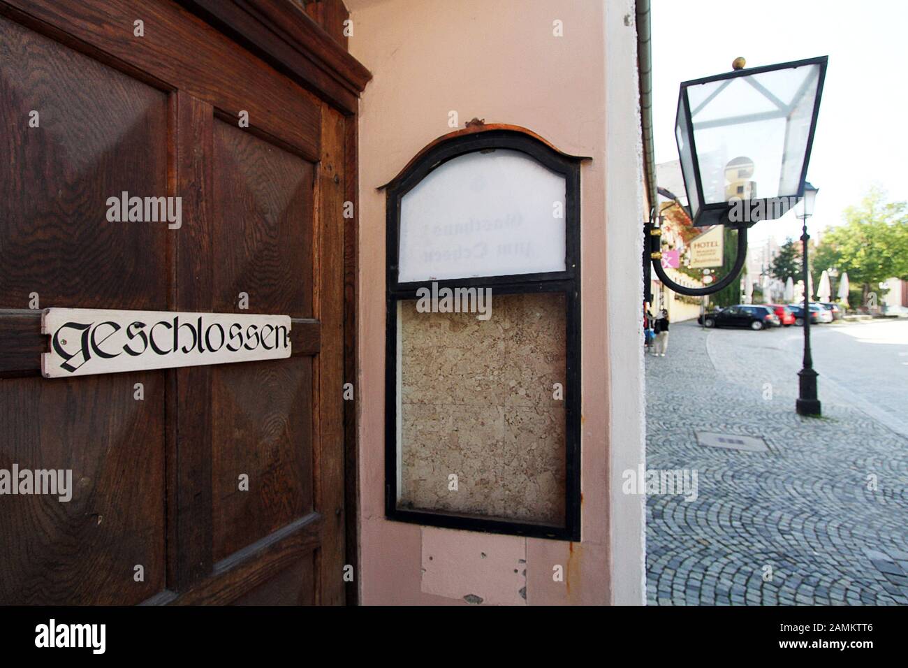 The former Gasthof Hörhammerbräu in the Konrad-Adenauer-Straße in Dachau has been deserted for decades. In the picture the entrance with a 'Closed' sign and the empty showcase for the menu. [automated translation] Stock Photo