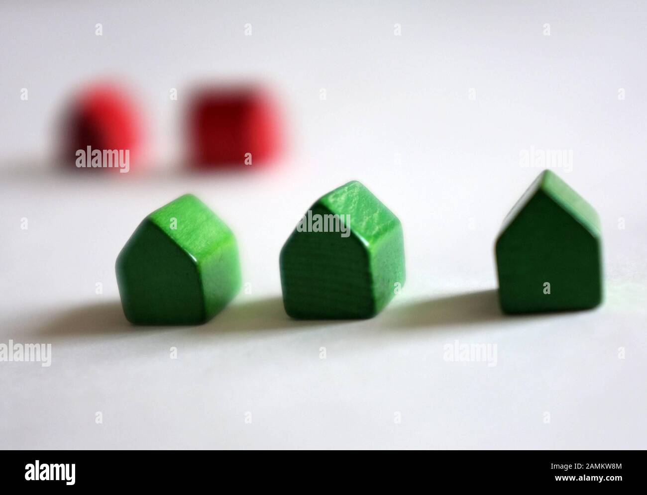 Red and green houses of a Monopoly game. [automated translation] Stock Photo