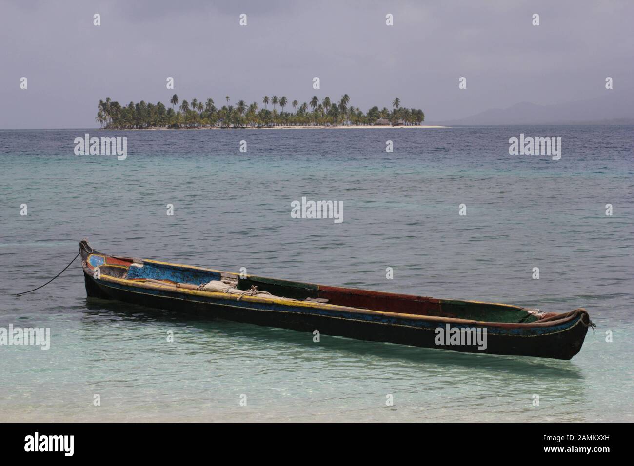 traditional canoe of the Kuna Indians on the sandy beach of the San