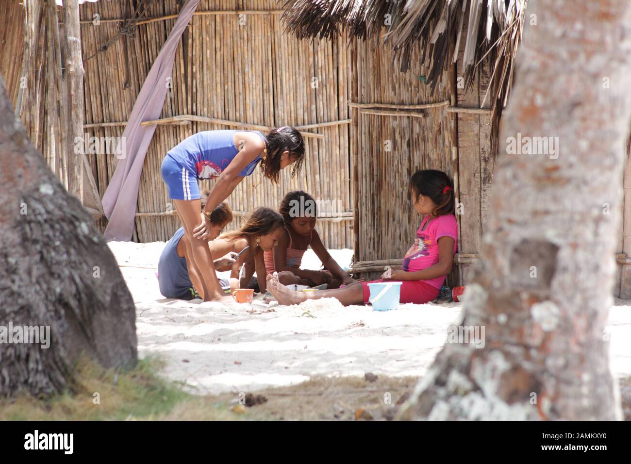 playing children of the Kuna Indians on the sandy beach of the San Blas