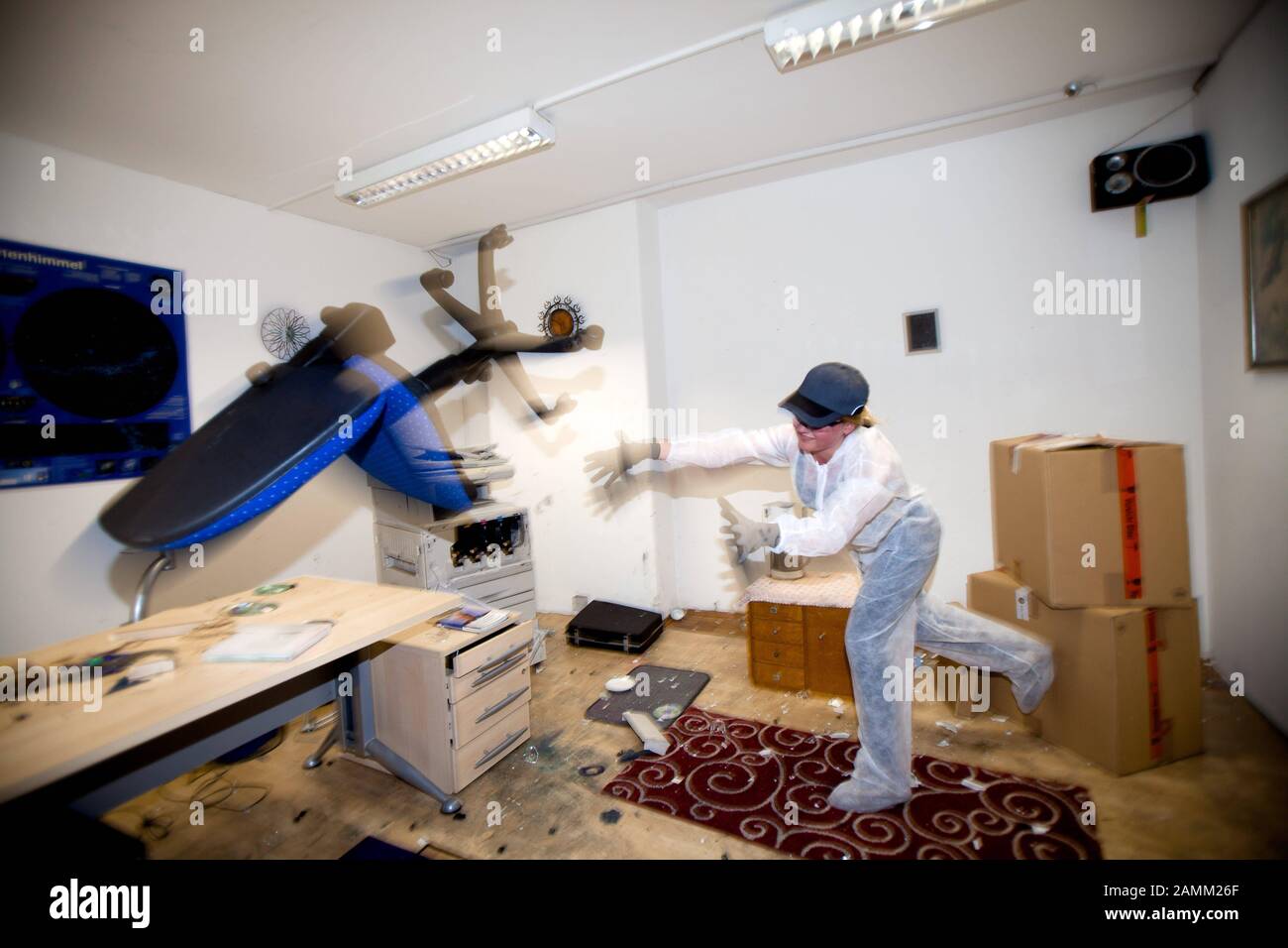A visitor to the Wutraum smashes the furnishings of an office in the Wutraum in Pasing. The anger room can be rented for various occasions and the furniture can be destroyed. [automated translation] Stock Photo