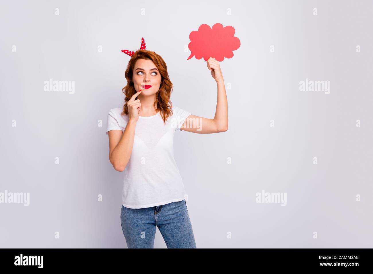 Portrait of her she nice-looking attractive lovely pretty cheerful cheery curious girl holding in hand paper cloud creating idea isolated over light Stock Photo