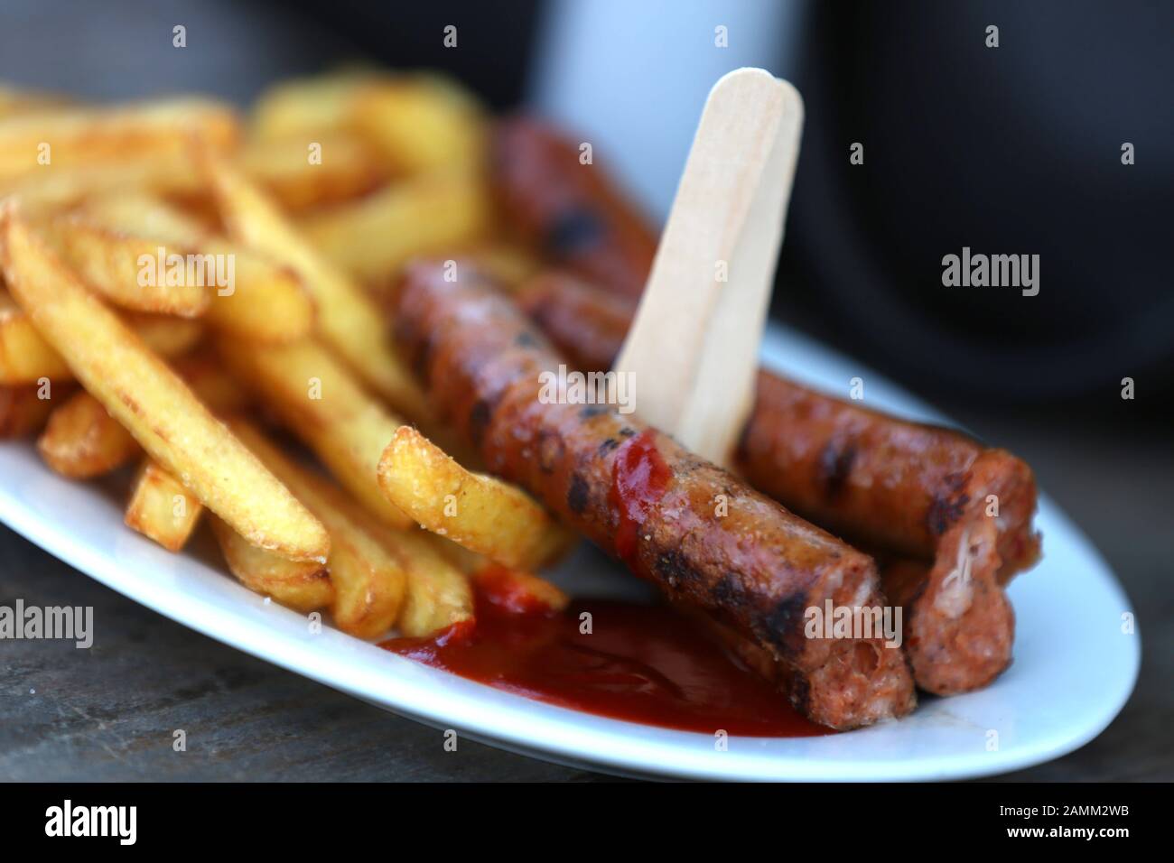 Bratwurst with French fries at the Tollwood Festival in Munich's