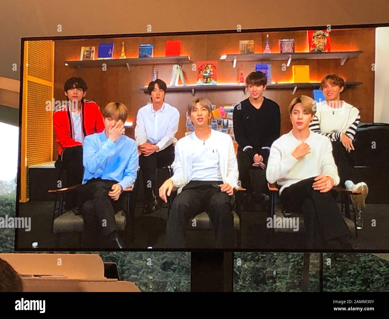 The members of Kpop band BTS appear via videolink to a press conference, as the band have unveiled their latest venture - an art project to create a 'positive message for the world'. Stock Photo