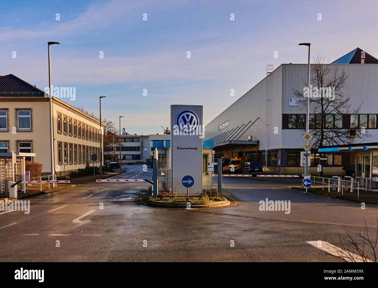 Braunschweig, Germany, January 11., 2020: Main entrance of the Volkswagen plant in Braunschweig, with doorman, guard and logo of the German car compan Stock Photo