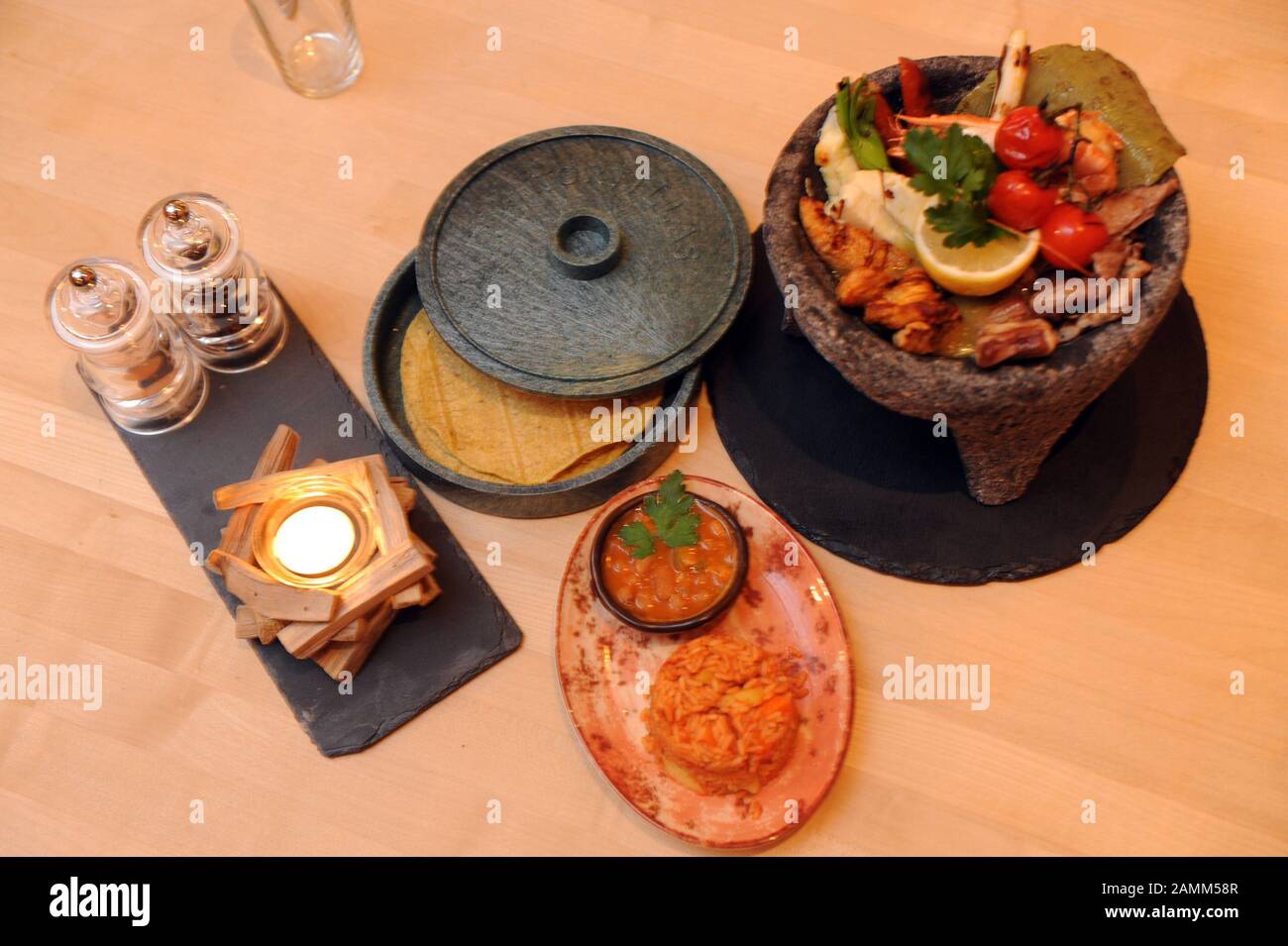 The typical Mexican dish "Molcajete" in the Mexican restaurant "Machete