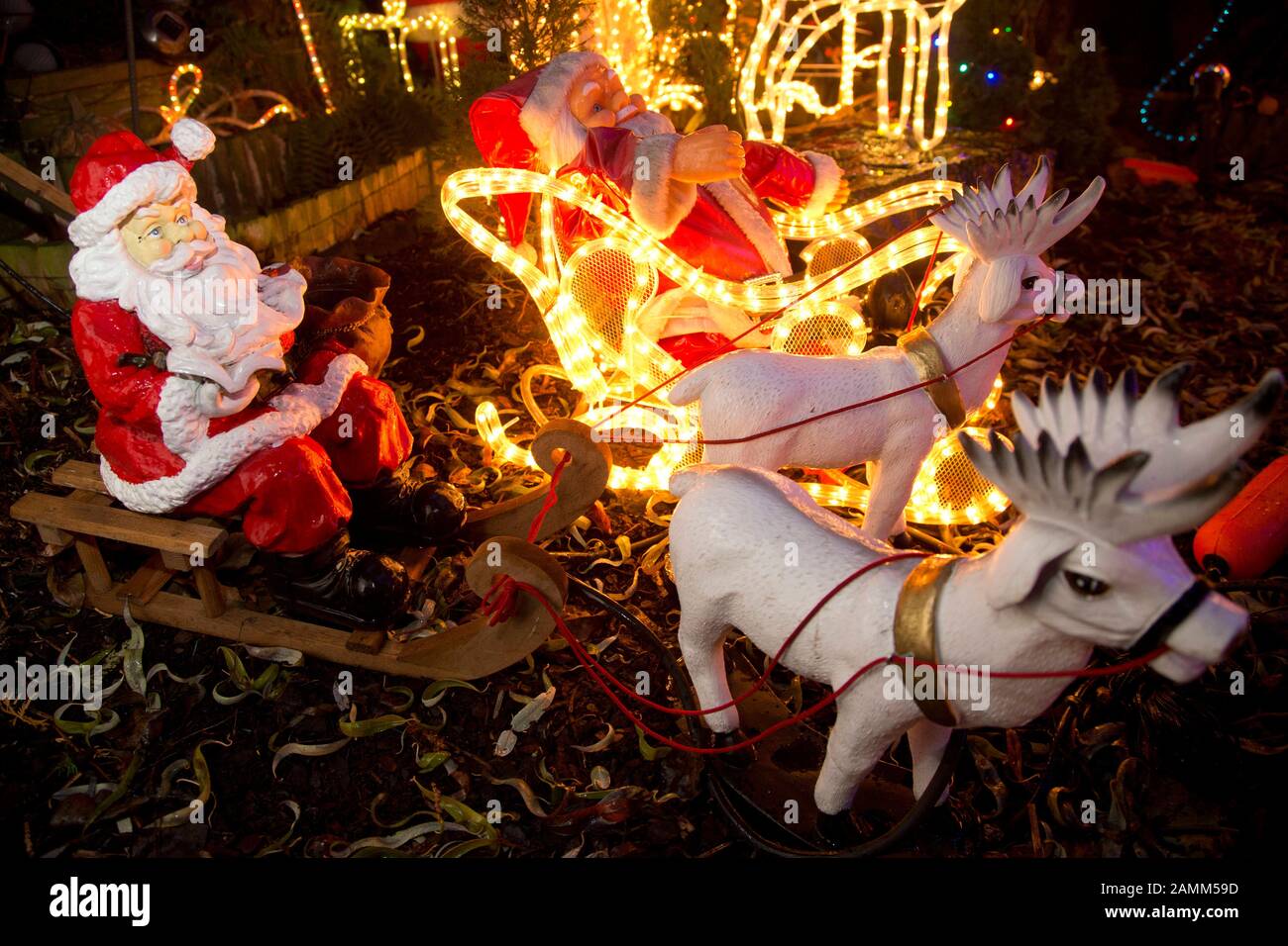 Christmas light show in the garden of a private house in Olching. In the picture Santa Claus with sleigh and reindeer. [automated translation] Stock Photo