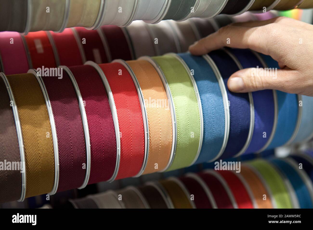 Fabric ribbons in different colours at the fabric fair 'Munich Fabric Start' in the Munich Order Center (MOC) in Freimann. [automated translation] Stock Photo