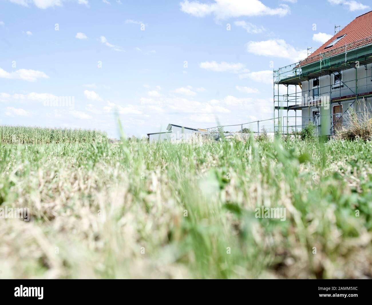 Scaffolded residential house under construction in the industrial area West in Maisach. [automated translation] Stock Photo