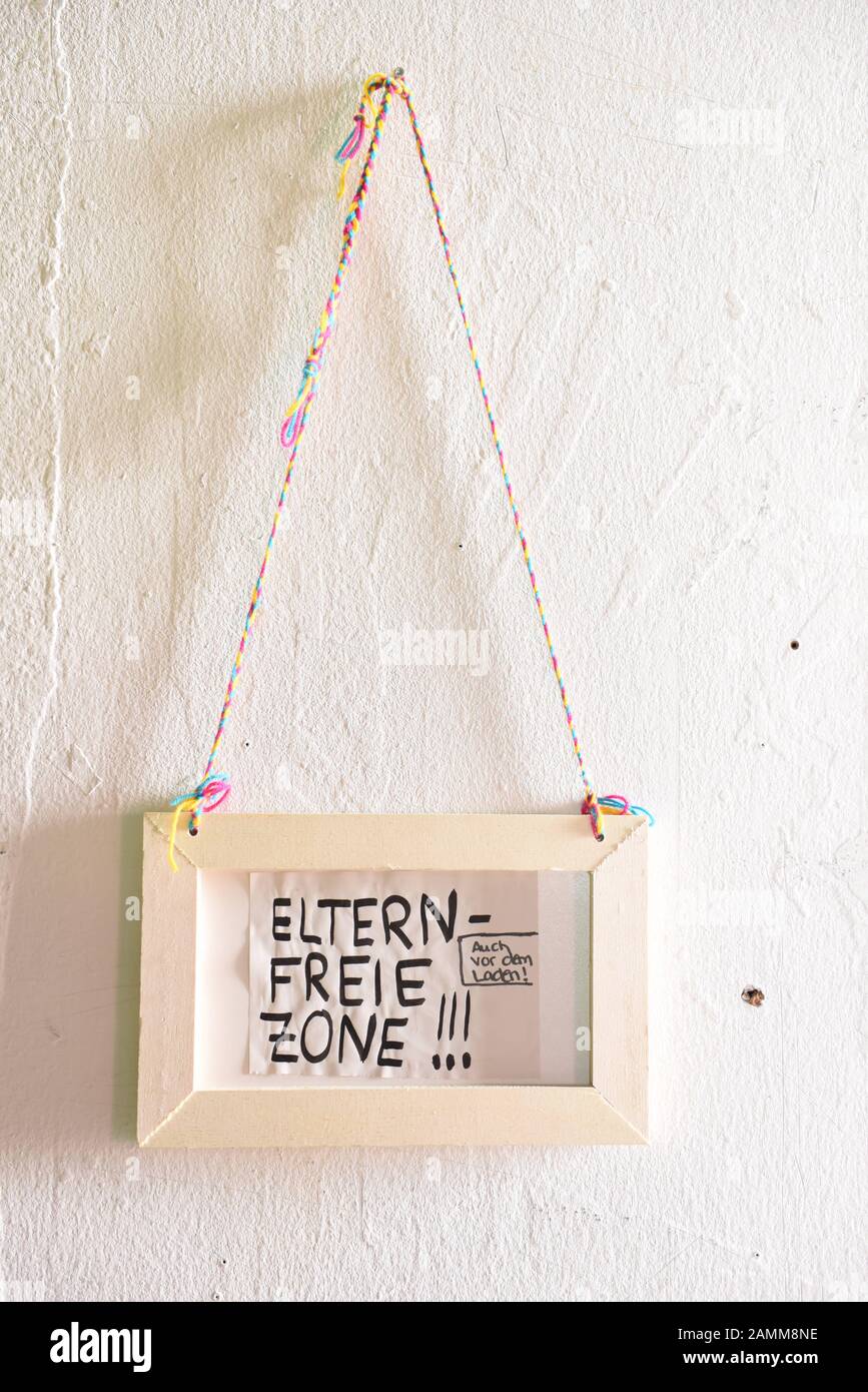 Sign "Elternfreie Zone" in the play town "Mini München" in the Zenith
