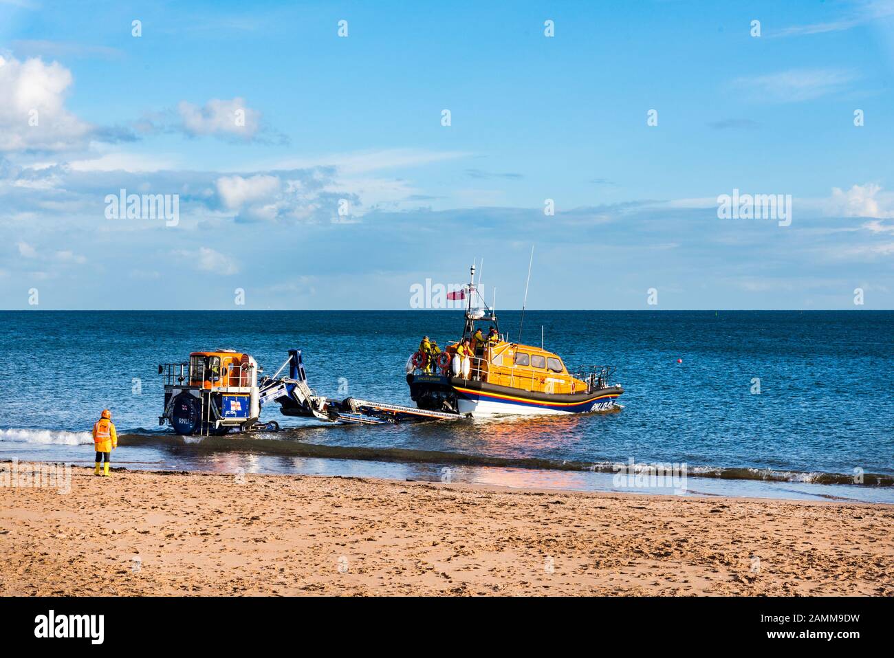 EXMOUTH, DEVON, UK - 3APR2019: RNLB R & J Welburn, a Shannon Class lifeboat, launching from Exmouth Beach  on a regular exercise. Stock Photo