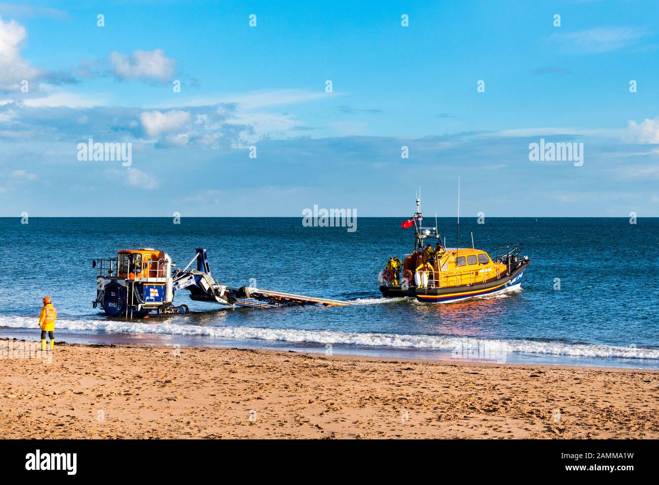 EXMOUTH, DEVON, UK - 3APR2019: RNLB R & J Welburn, a Shannon Class lifeboat, launching from Exmouth Beach  on a regular exercise. Stock Photo
