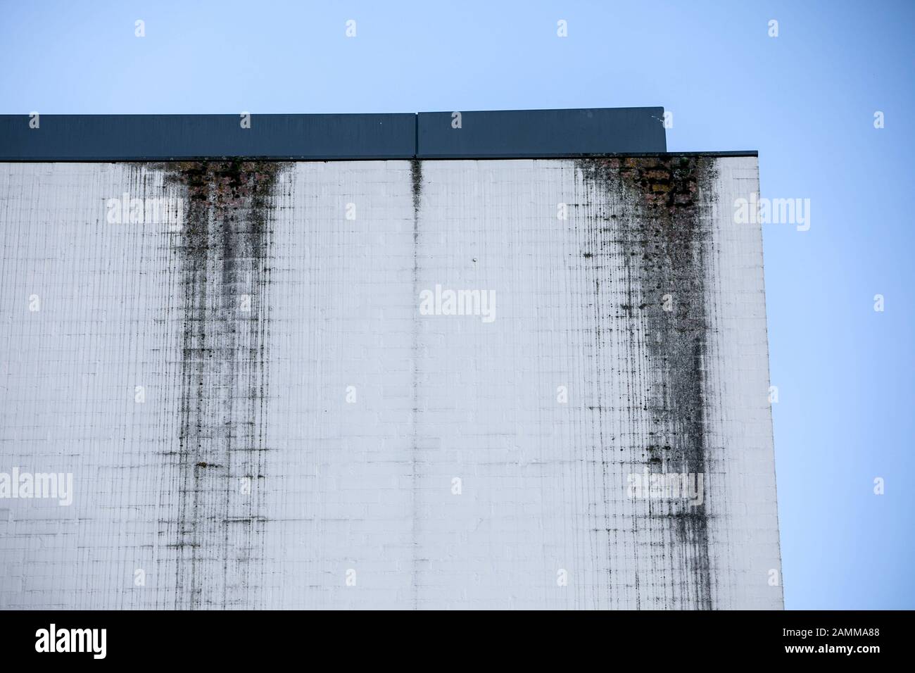 Construction defects at the ecumenical church centre on the Platz der Menschenrechte (Human Rights Square) in Messestadt Riem: the once snow-white façade now shows dark streaks that impair the visual impression. [automated translation] Stock Photo