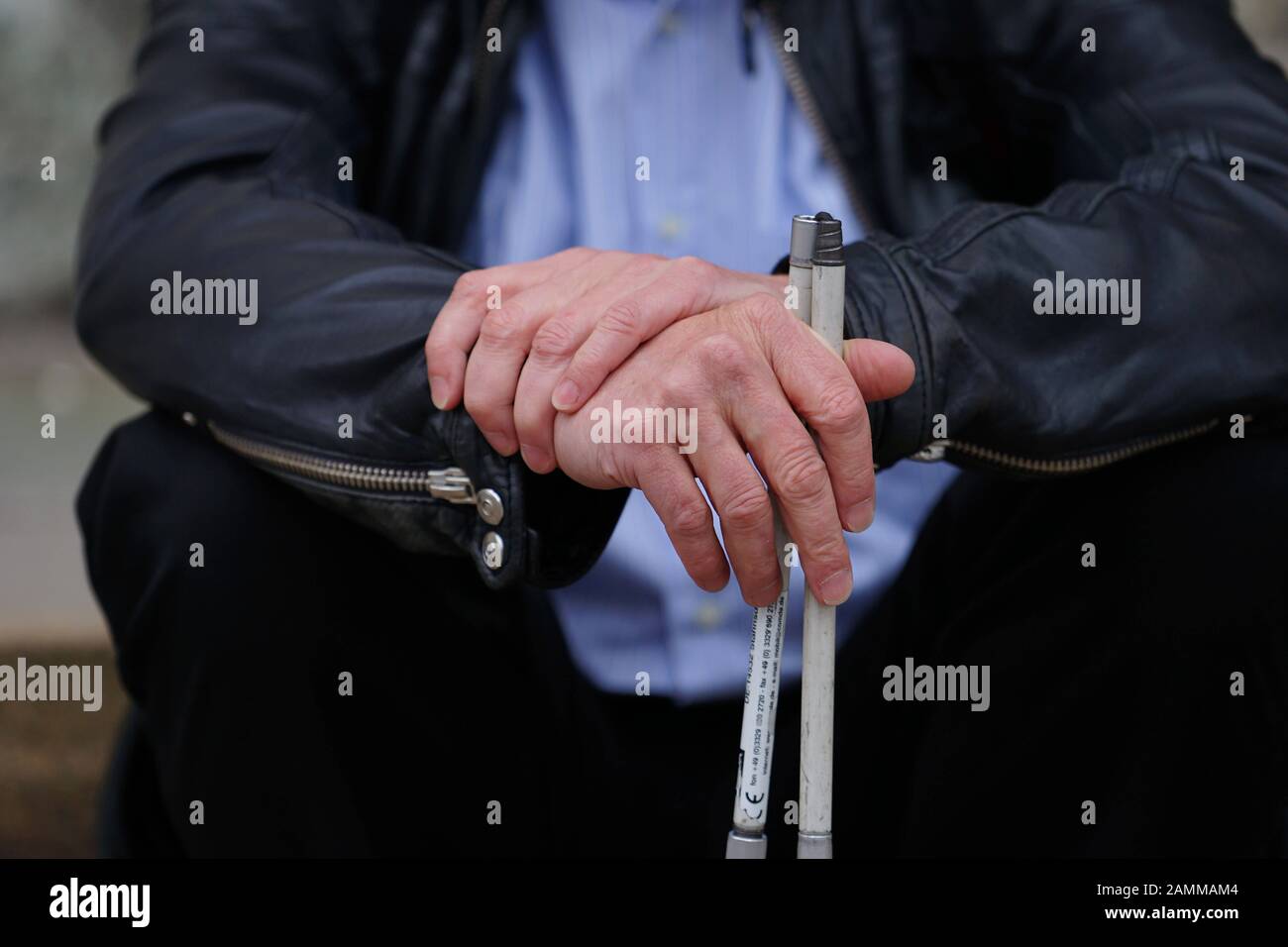 Visually impaired person with cane for the blind in Munich. [automated