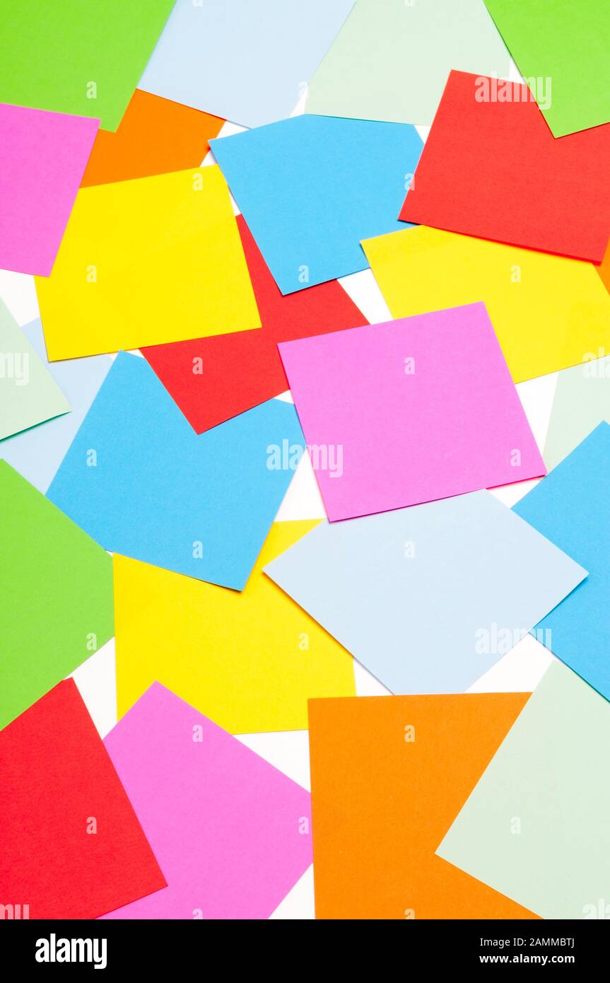 Colorful background of square paper memo sheets scattered on a white background Stock Photo