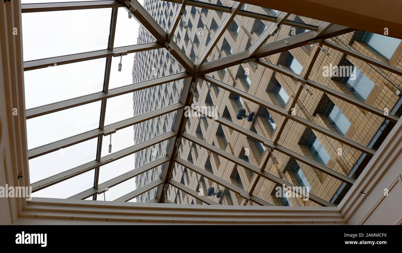 Building seen through the glass roof at the Arndale Center, Manchester. Stock Photo