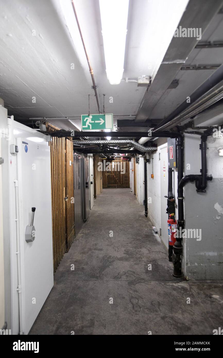 Water pipes and storage compartments in a cellar in need of renovation