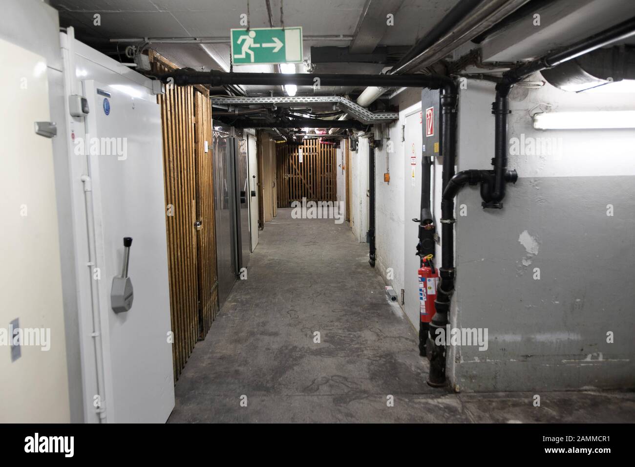 Water pipes and storage compartments in a cellar in need of renovation