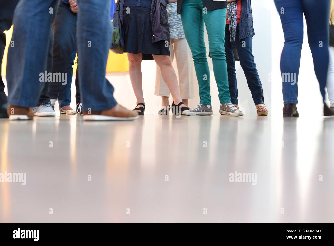During a guided tour in Munich's Lenbachhaus, visitors stride across the museum's shiny floor. [automated translation] Stock Photo