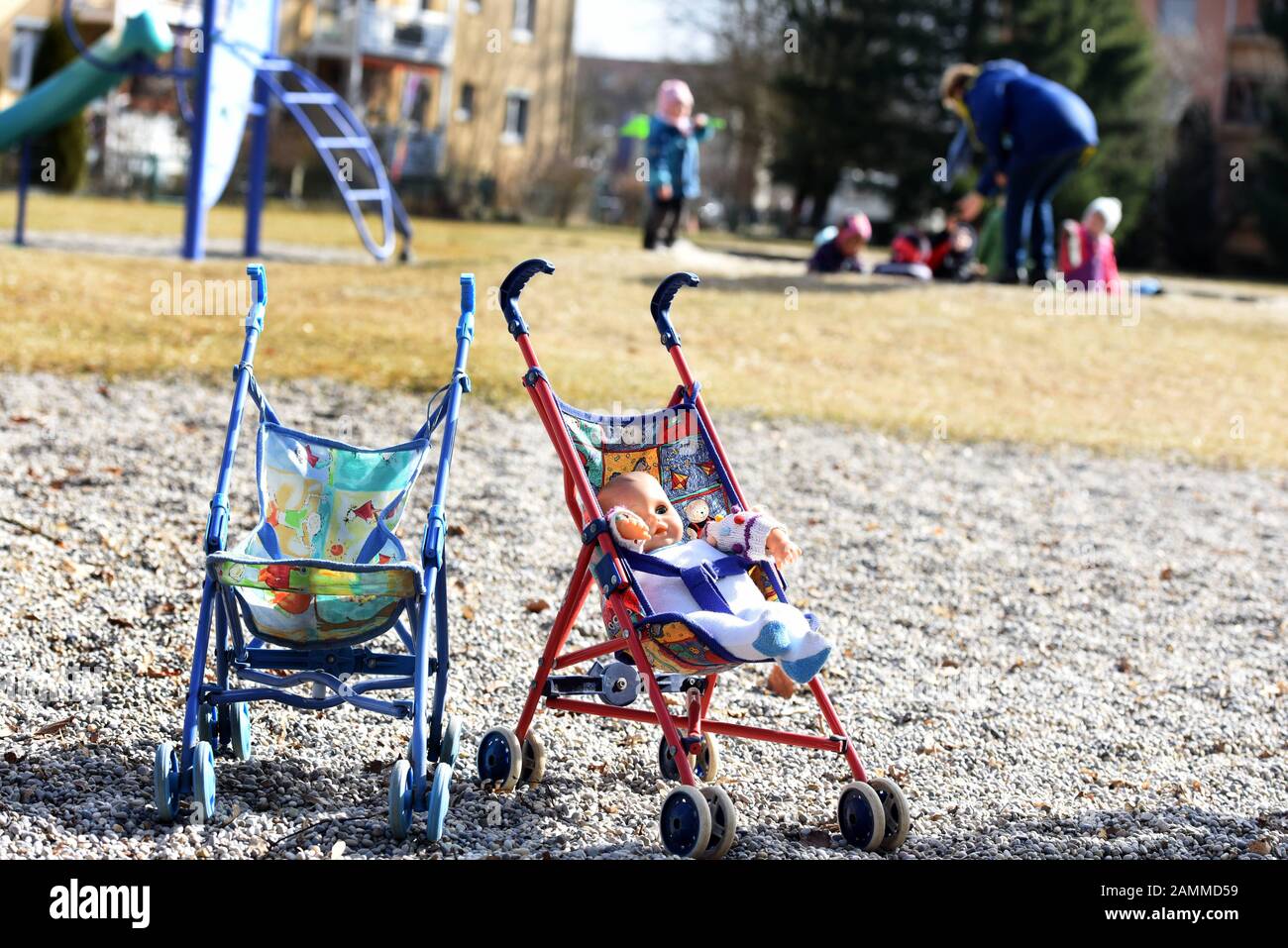 Doll prams on a playground in Munich. [automated translation] Stock Photo