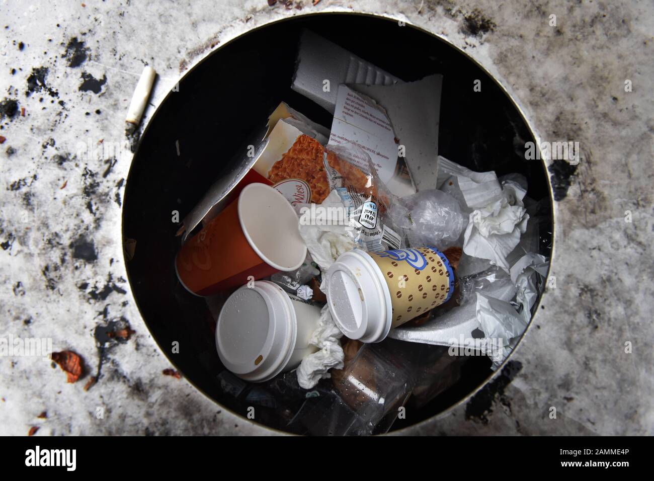 Litter bin with disposed "Coffee to go" disposable cups at Munich's