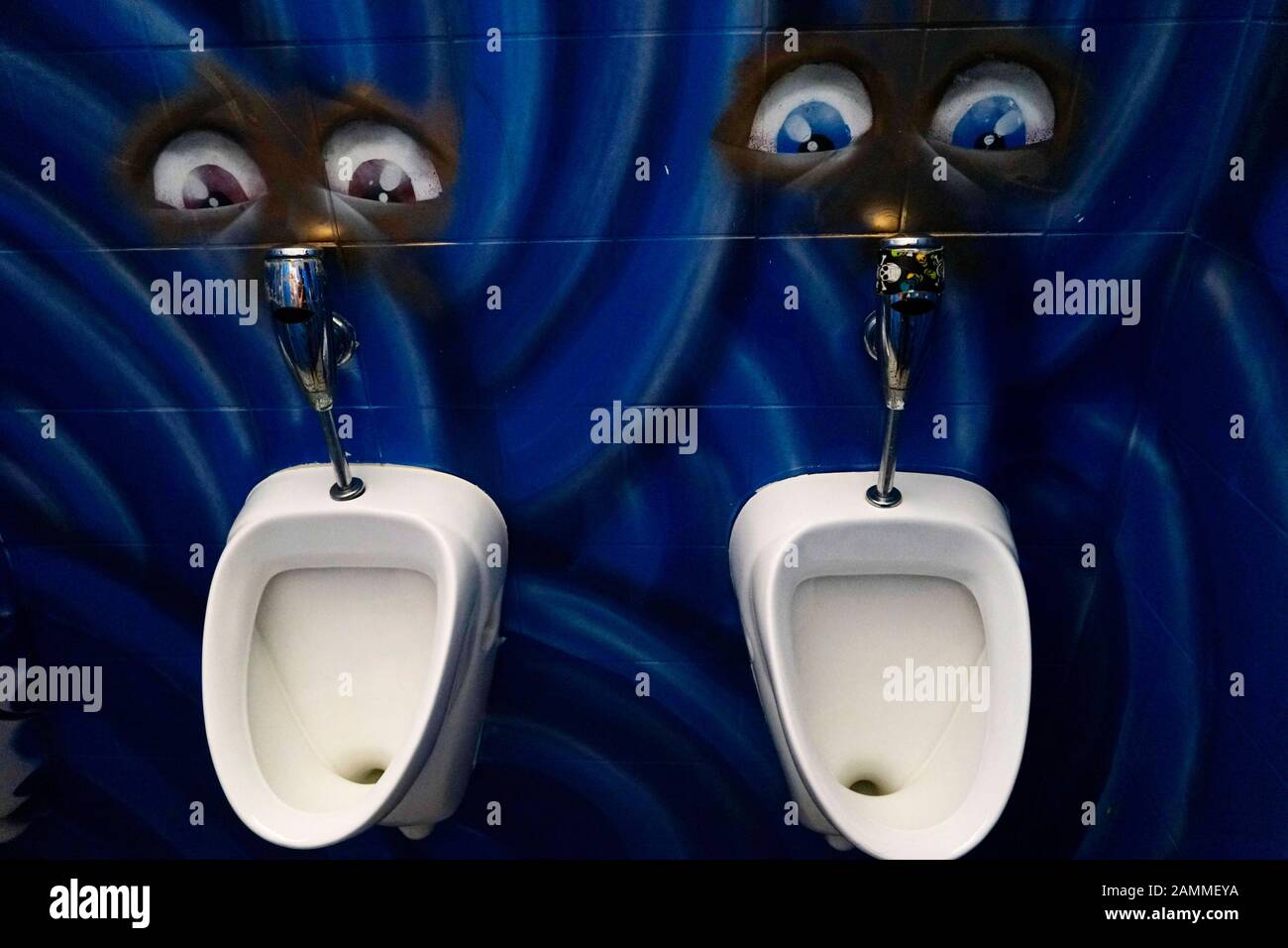 Urinals with "eyes" in the men's toilet in the "Südstadt" pub in Munich