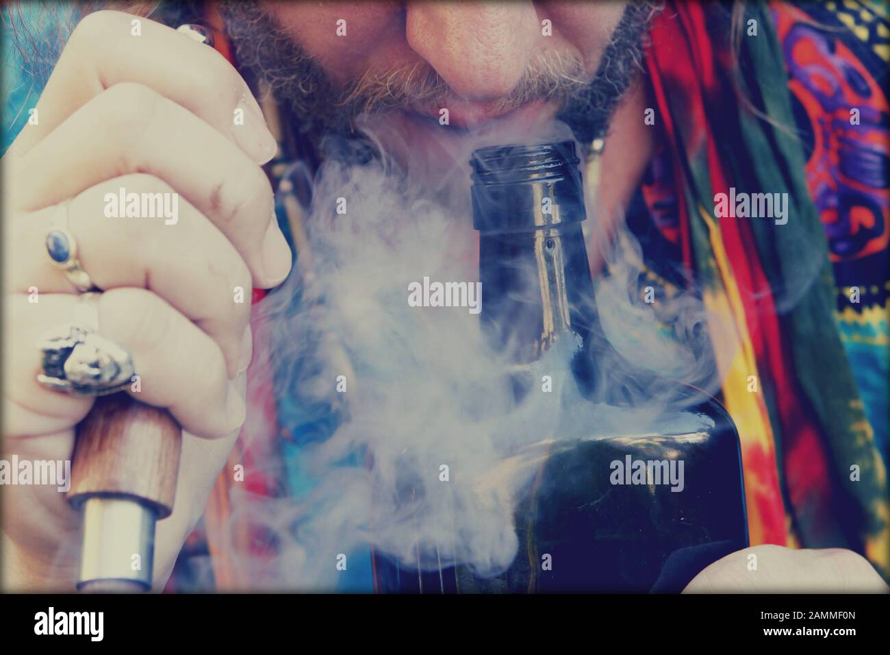 The shaman smokes the Ayahuasca drink and asks for positive spirit