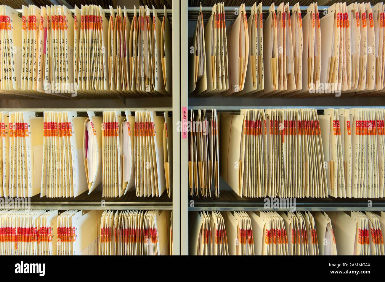 Various folders containing files on asylum proceedings have been hung up at the Bavarian Administrative Court in Munich. [automated translation] Stock Photo
