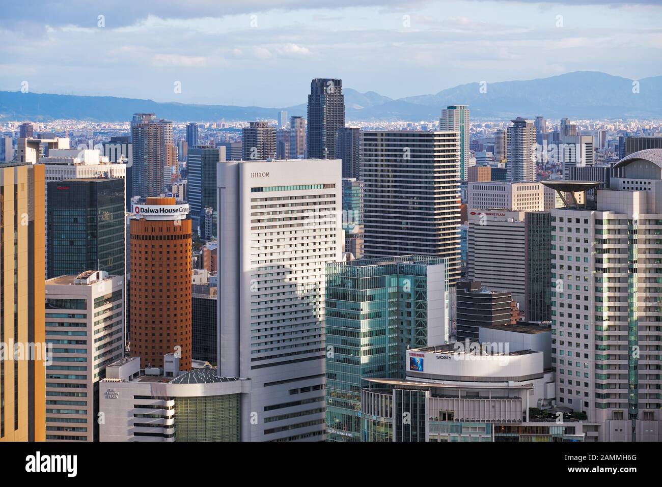 OSAKA, JAPAN - OCTOBER 15, 2019: The view from the Umeda Sky Building Observatory to the skyscraper center with Herbis Plaza in front of JR Osaka Stat Stock Photo