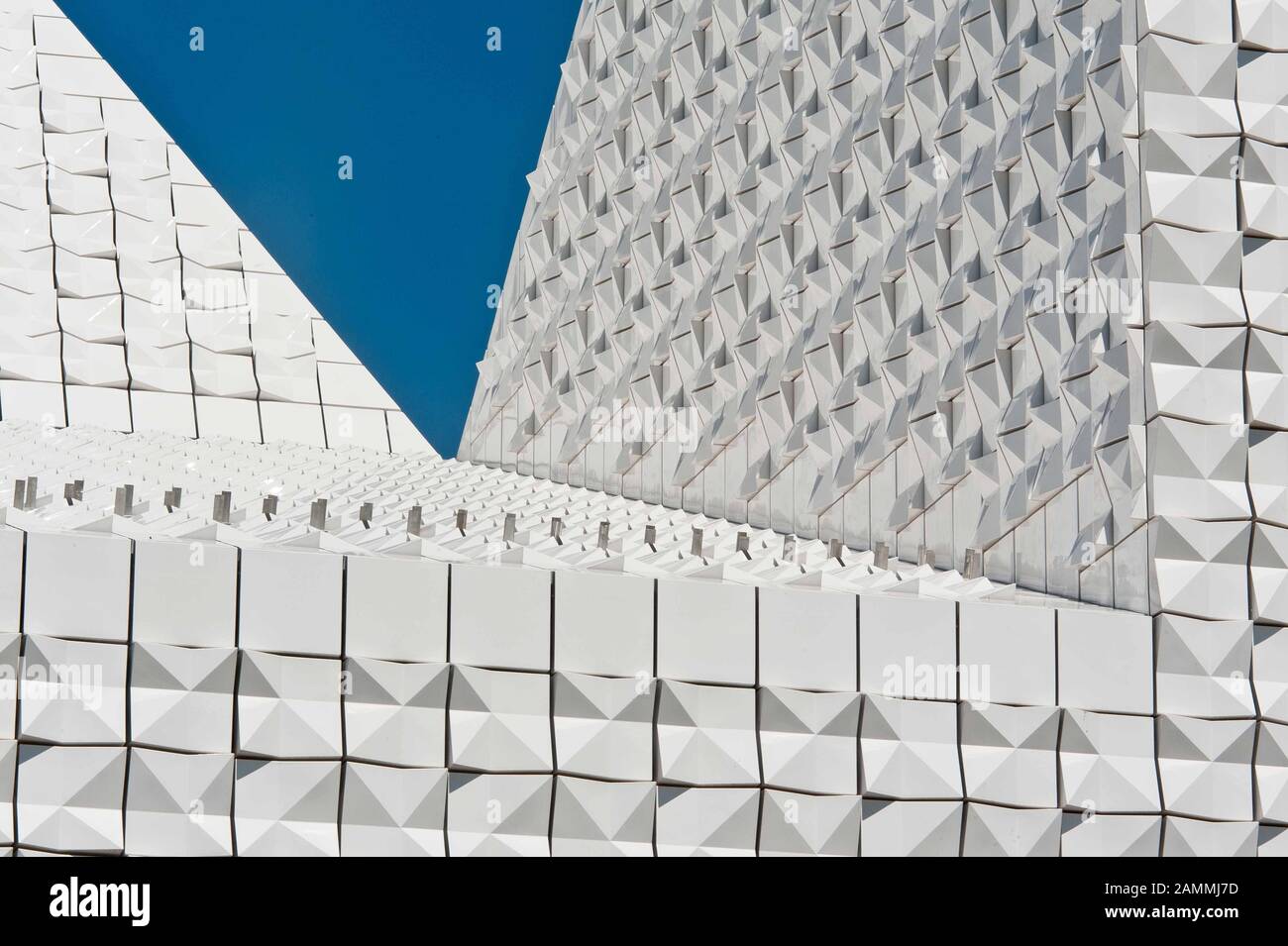 The newly built Catholic parish church Seliger Pater Rupert Mayer in Poing (architect: Andreas Meck). The façade consists of white ceramic tiles glistening in the sun. [automated translation] Stock Photo