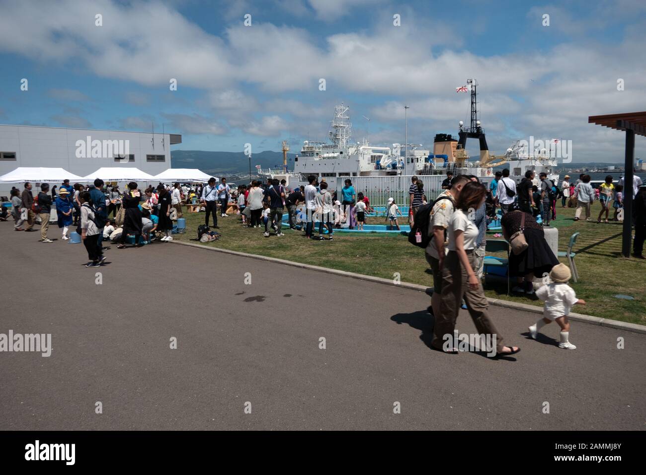 Japanese people and kids having fun and playing with sea animals at Marine Festival in Hakodate, Hokkaido, Japan, Asia Stock Photo