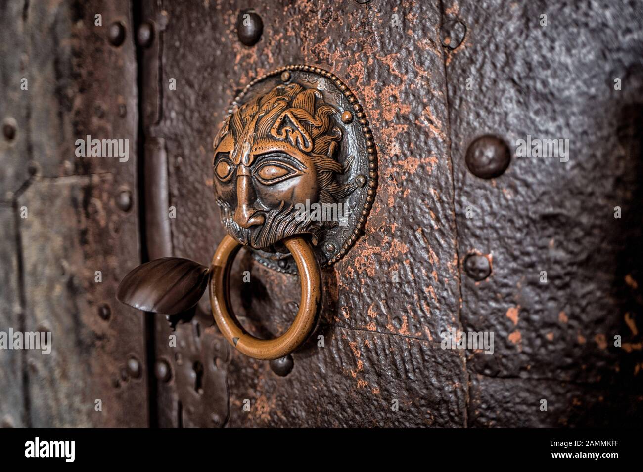 Bronze door opener in the shape of a lion's head. Portal as well as buildings overall date from the 8th to 9th century. [automated translation] Stock Photo